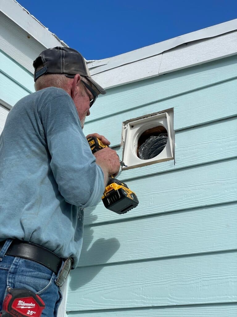 Install range hood vent.